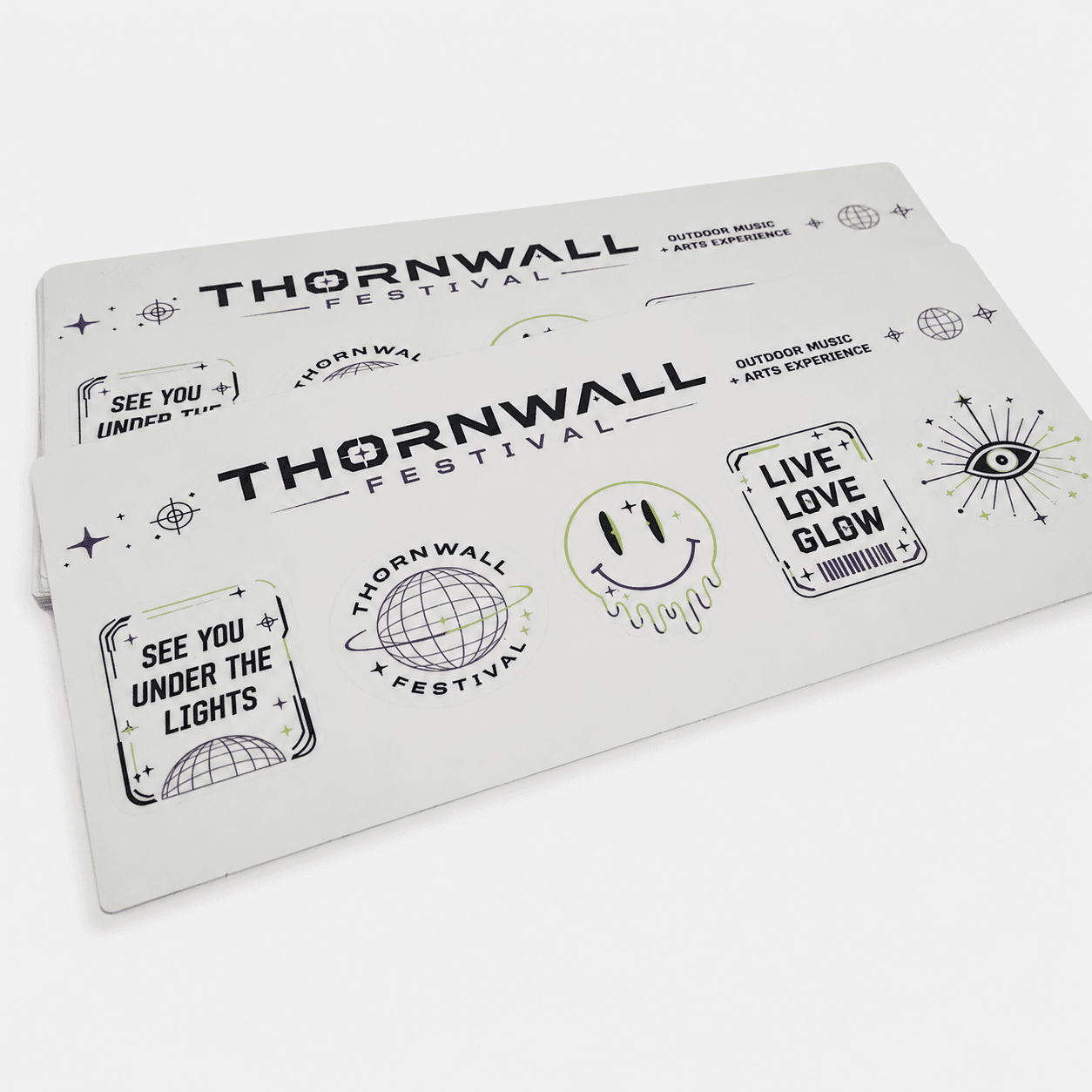 Custom glow-in-the-dark festival sticker sheet with branded event stickers, promotional graphics, and kiss-cut sticker designs.
