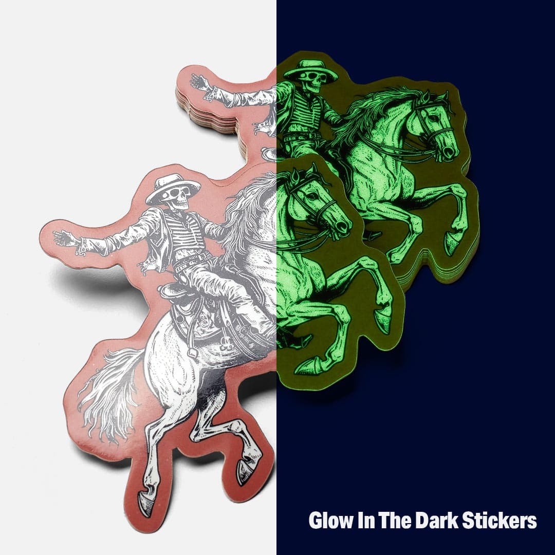 Glow in the dark die cut stickers shown in daylight and glowing in darkness, featuring a skeleton riding a horse design.