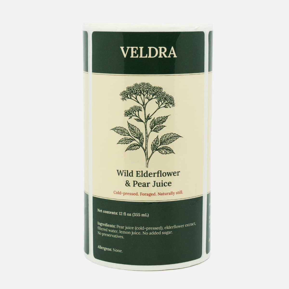 Roll of custom juice labels for Veldra Wild Elderflower and Pear Juice with a dark green and cream botanical design.