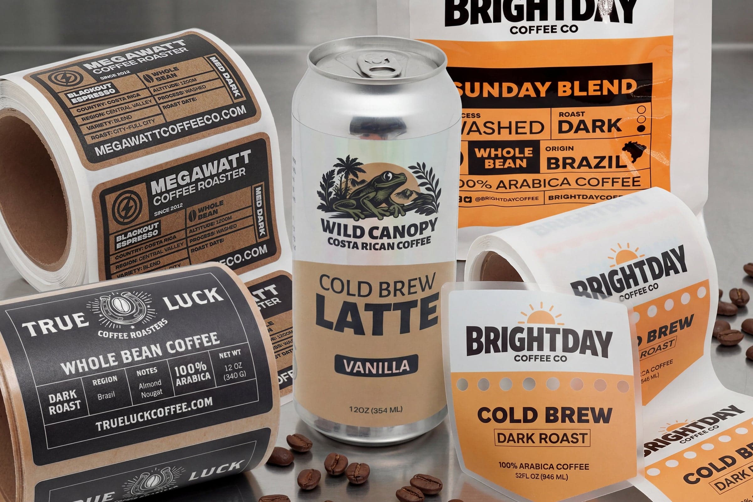 Custom coffee labels on rolls, cold brew can labels, coffee bag labels, and product packaging labels for coffee brands and beverage packaging.