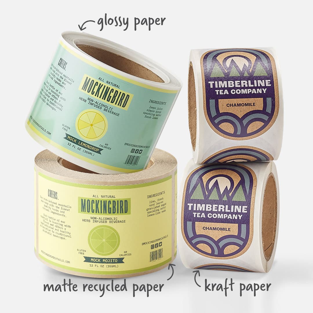 Glossy paper, matte recycled paper, and kraft paper label rolls shown as custom packaging label material options.
