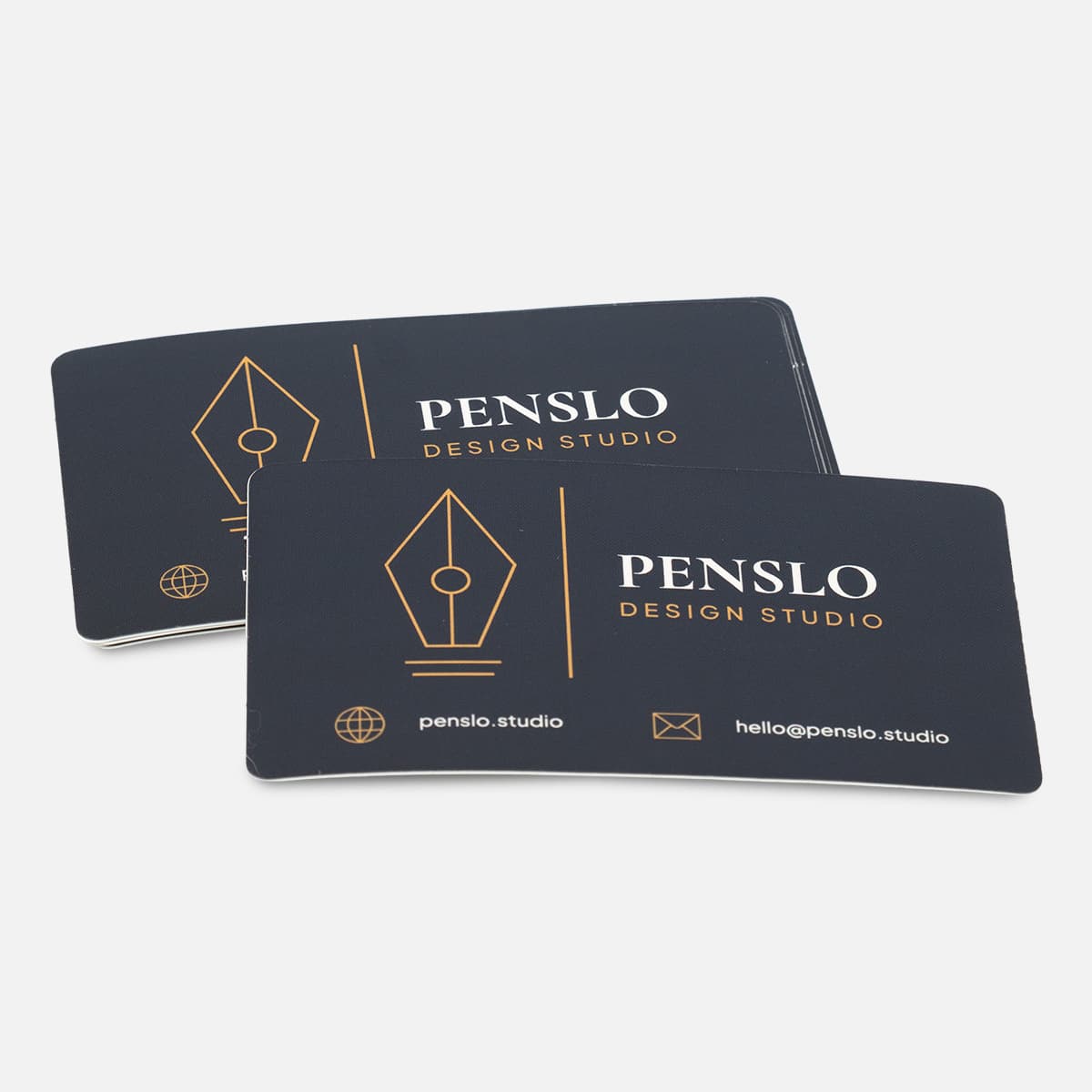 Stack of custom rectangle Penslo Design Studio stickers with a black, white, and gold business card design.