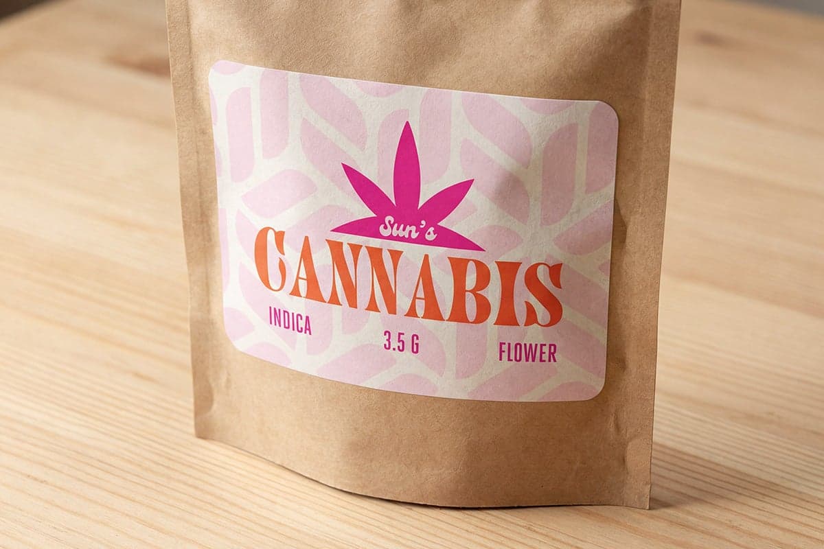 Kraft paper cannabis flower pouch with a custom printed product label applied to the front.