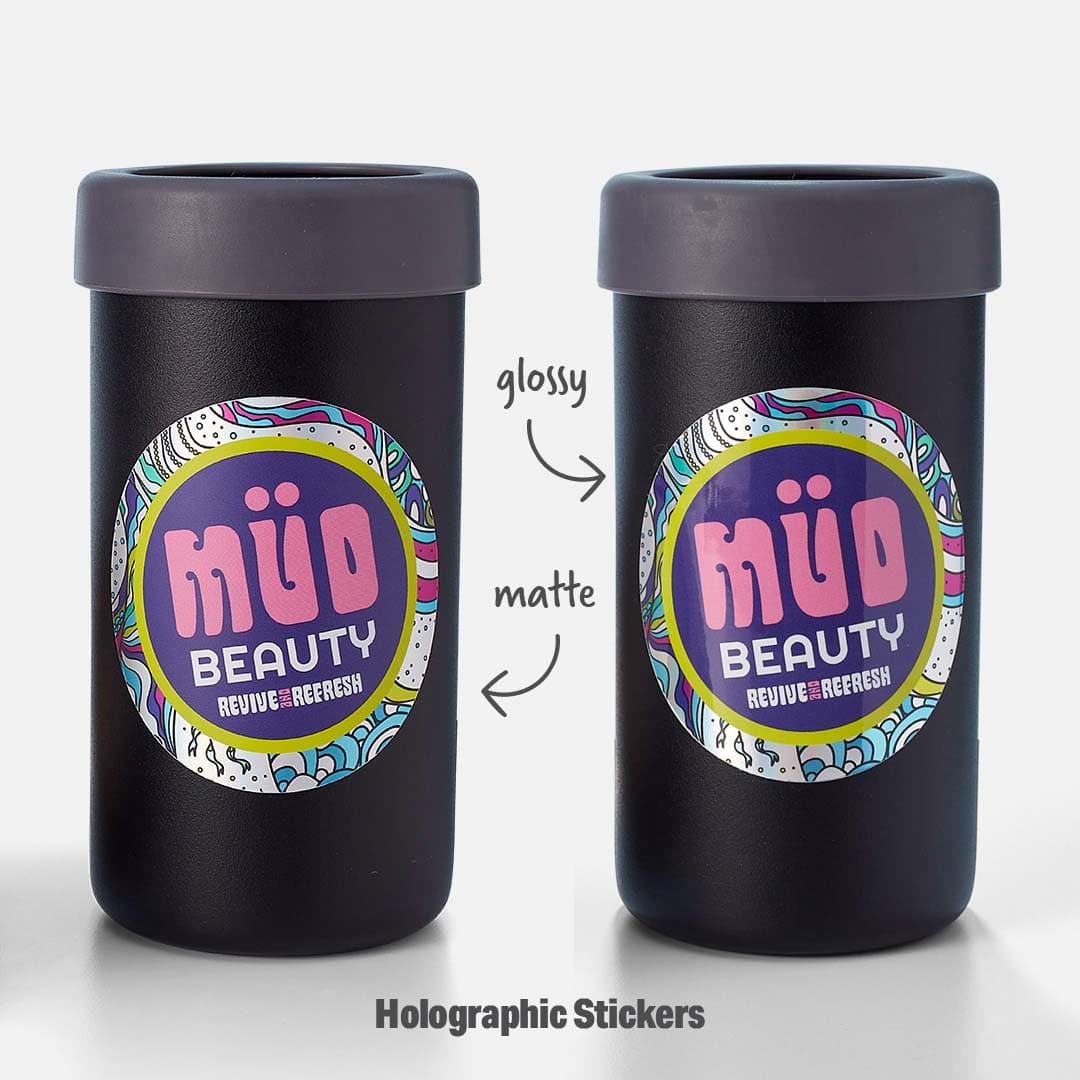 Two black containers displaying the same holographic sticker design, comparing glossy and matte laminate finishes on custom holographic stickers.