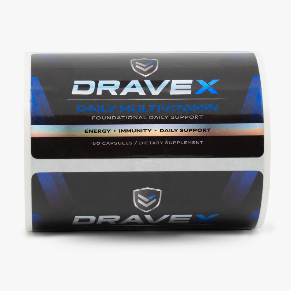 Roll of custom holographic supplement labels for DraveX Daily Multivitamin with black, blue, and metallic label design.