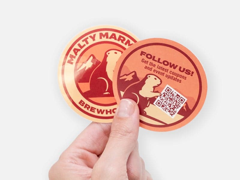 Backprinted brewery sticker featuring custom branding on the front and a QR code on the reverse for brewery promotions and customer interaction.