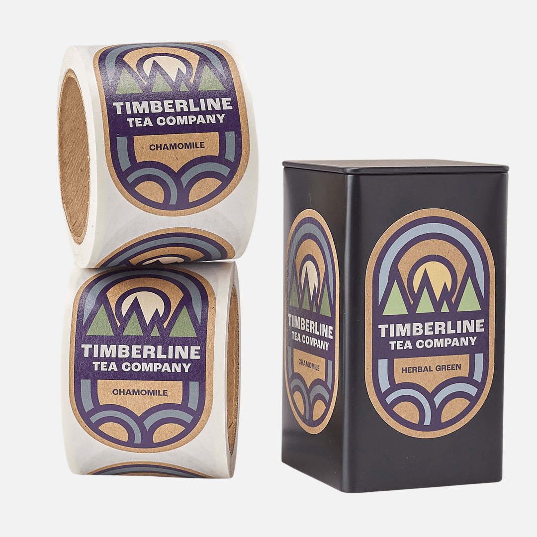 Custom kraft paper labels applied to tea tins with matching roll labels for retail packaging.