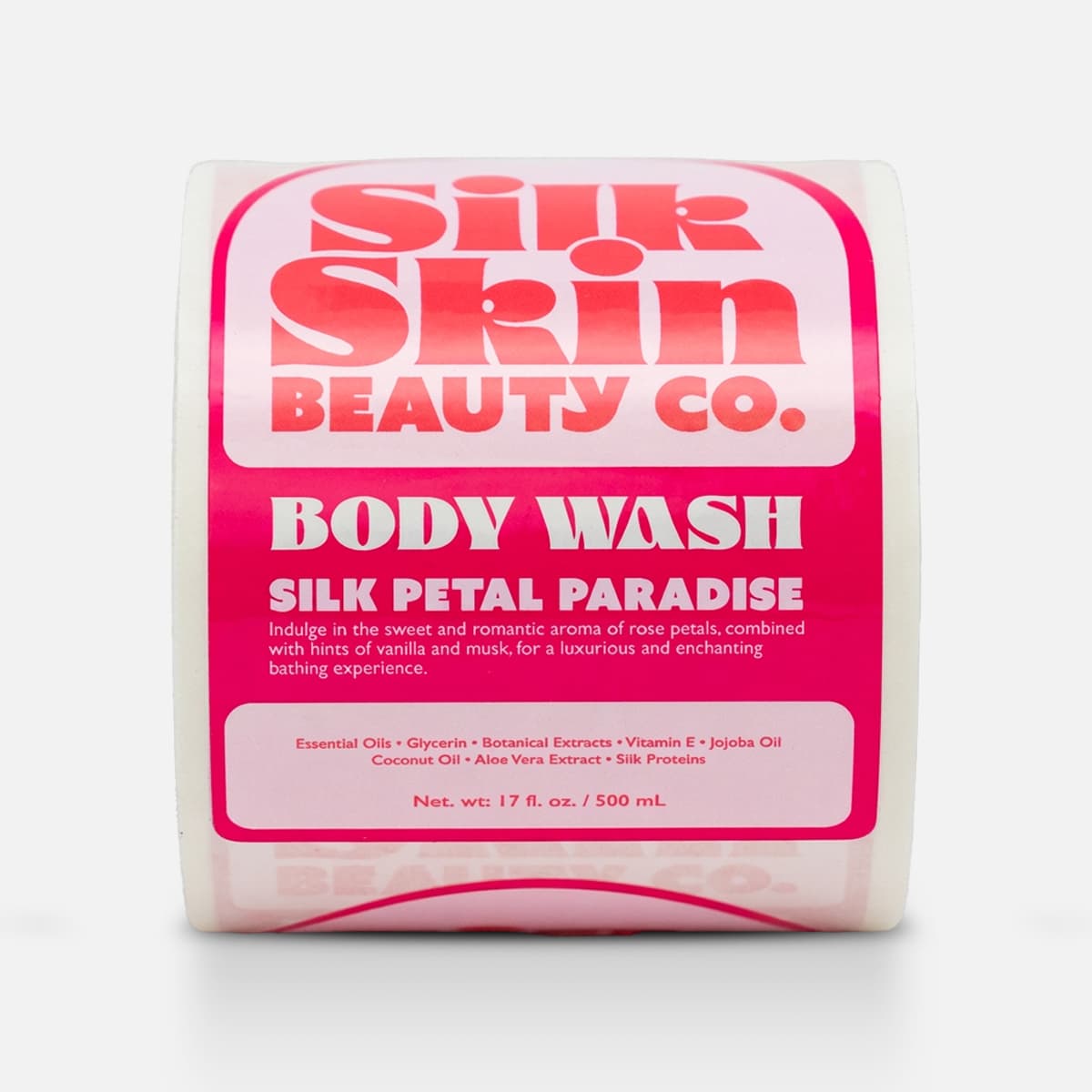 Roll of custom body wash labels for SilkSkin Beauty Co. with a bright pink Silk Petal Paradise design.