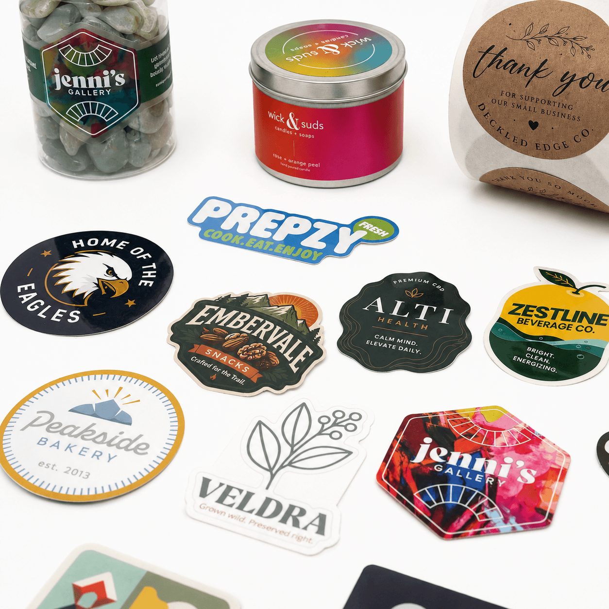 Collection of custom die cut stickers, product labels, and branded packaging showcasing premium sticker and label printing for businesses.