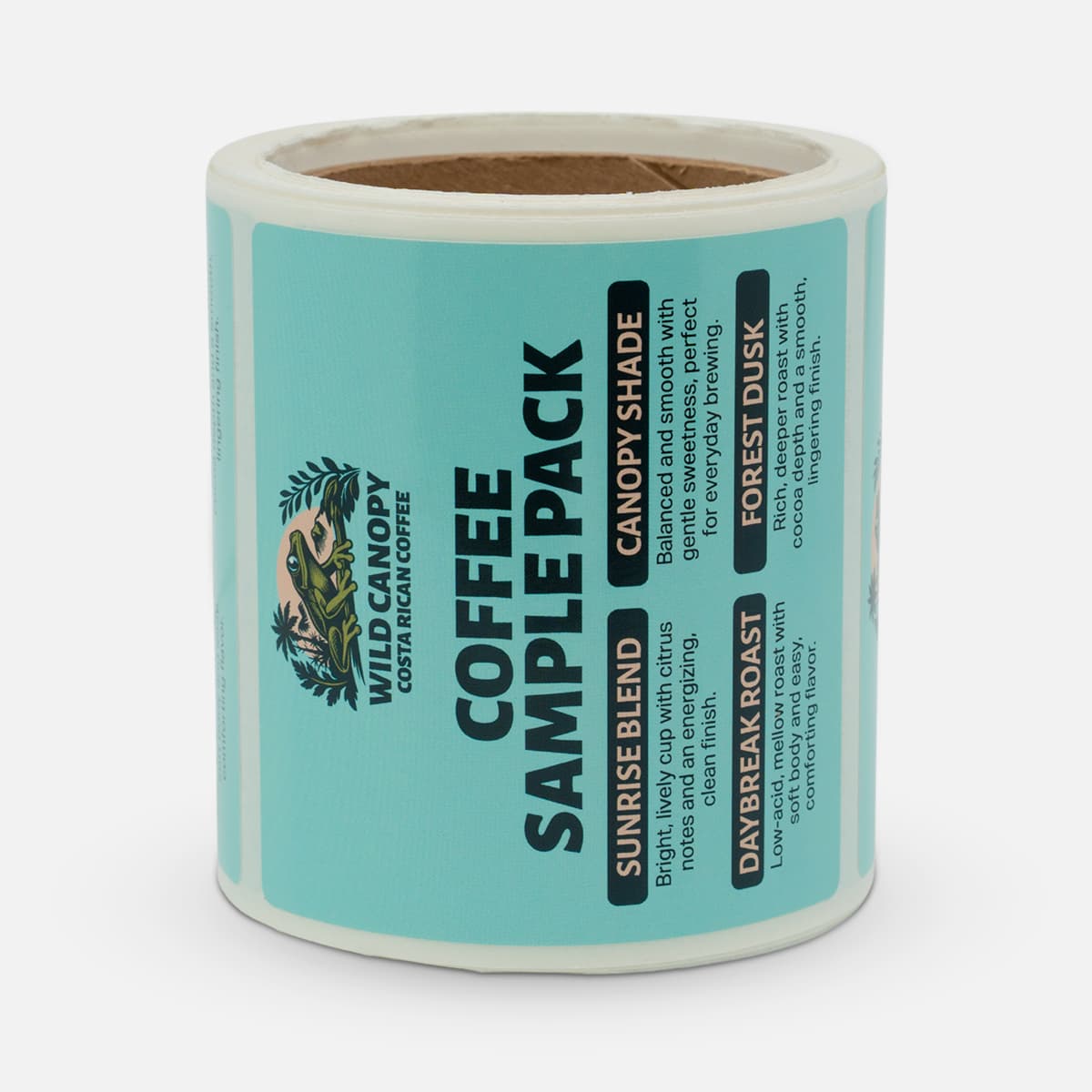 Roll of custom coffee sample pack labels for Wild Canopy Costa Rican Coffee, featuring turquoise artwork and flavor descriptions.